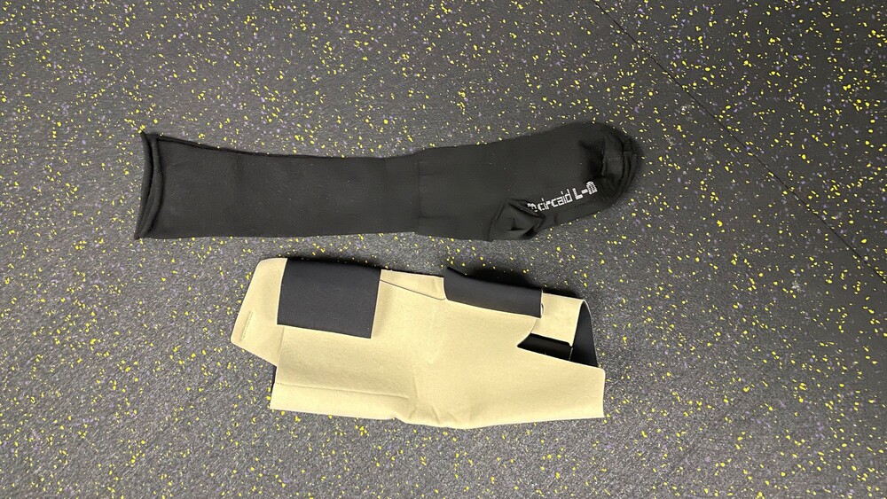Aircast Large Black Compression Sleeve and Beige Adjustable Knee Brace